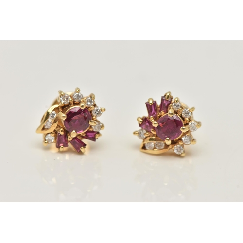 18 - A PAIR OF YELLOW METAL RUBY AND DIAMOND EARRINGS, each designed as a cluster set with a central circ... 