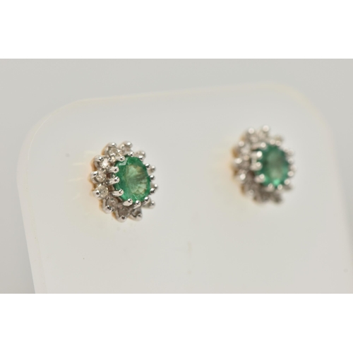 20 - A PAIR OF EMERALD AND DIAMOND EARRINGS AND A PENDANT, each earring designed as an oval cluster, set ... 