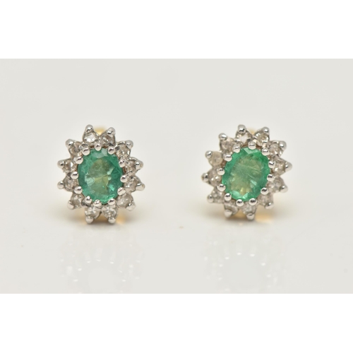 20 - A PAIR OF EMERALD AND DIAMOND EARRINGS AND A PENDANT, each earring designed as an oval cluster, set ... 