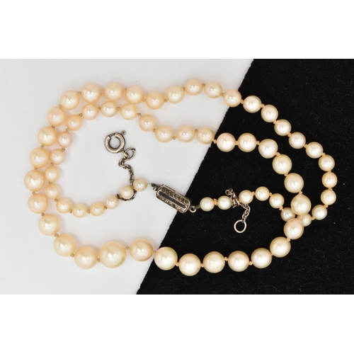 21 - A CULTURED PEARL NECKLACE, a single row of graduated cream pearls, individually knotted on a white c... 