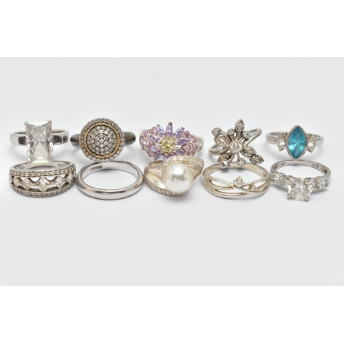 22 - TEN WHITE METAL RINGS, an assortment of white metal dress rings, most set with cubic zirconia stones... 