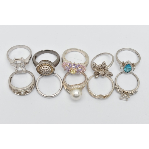 22 - TEN WHITE METAL RINGS, an assortment of white metal dress rings, most set with cubic zirconia stones... 