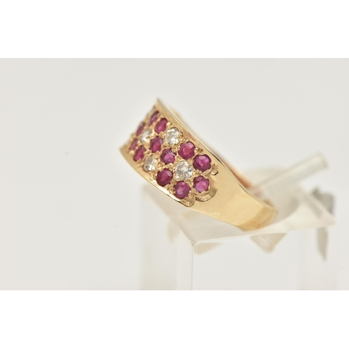 3 - A 14CT YELLOW GOLD RUBY AND DIAMOND SET RING, pave set with circular cut rubies and brilliant cut di... 