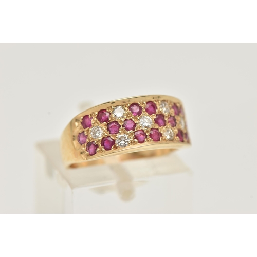 3 - A 14CT YELLOW GOLD RUBY AND DIAMOND SET RING, pave set with circular cut rubies and brilliant cut di... 