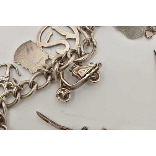 31 - A SMALL BAG OF WHITE METAL JEWELLERY, a silver curb link bracelet, links stamped with sterling marks... 