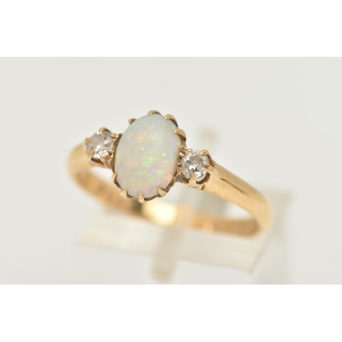 5 - AN 18CT YELLOW GOLD, OPAL AND DIAMOND RING, designed as a central oval cut opal cabochon, claw set, ... 