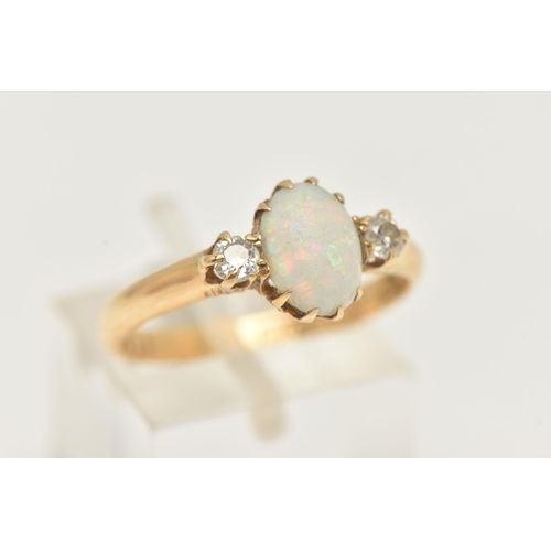 5 - AN 18CT YELLOW GOLD, OPAL AND DIAMOND RING, designed as a central oval cut opal cabochon, claw set, ... 