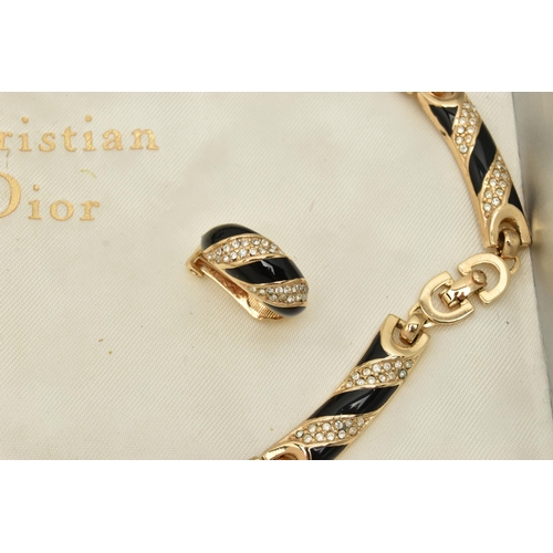 60 - A THREE PIECE 'CHRISTIAN DIOR' SET, to include a necklace, bracelet and clip on earrings, gold plate... 