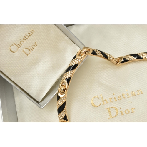 60 - A THREE PIECE 'CHRISTIAN DIOR' SET, to include a necklace, bracelet and clip on earrings, gold plate... 