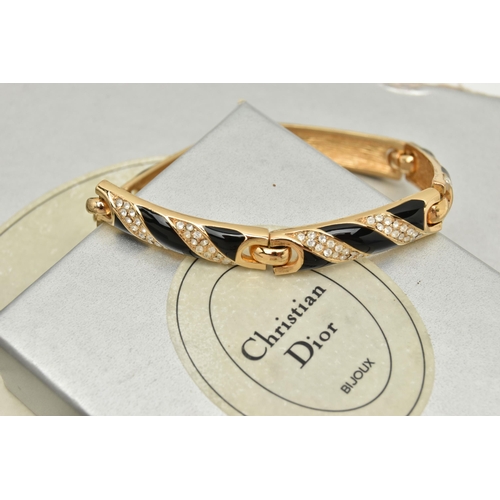 60 - A THREE PIECE 'CHRISTIAN DIOR' SET, to include a necklace, bracelet and clip on earrings, gold plate... 