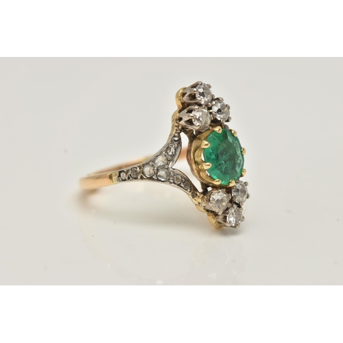 63 - AN 18CT GOLD EMERALD AND DIAMOND DRESS RING, centrally set with an oval cut emerald in an eight claw... 