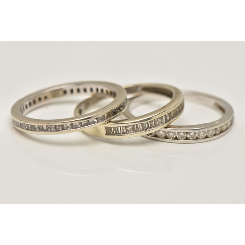 69 - ONE 9CT WHITE GOLD DIAMOND ETERNITY RING AND TWO HALF ETERNITY RINGS, all channel set, the full eter... 