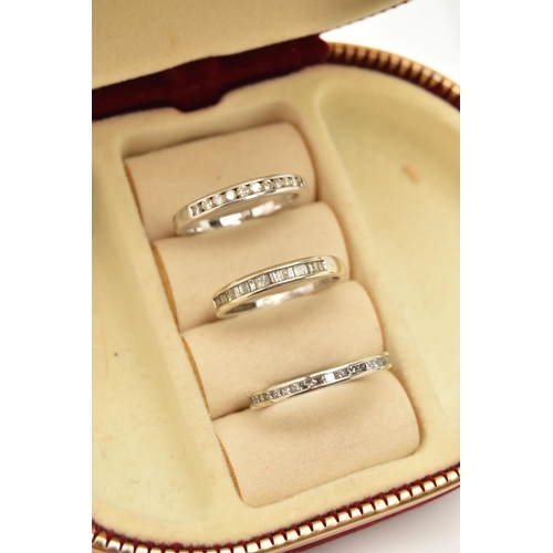 69 - ONE 9CT WHITE GOLD DIAMOND ETERNITY RING AND TWO HALF ETERNITY RINGS, all channel set, the full eter... 