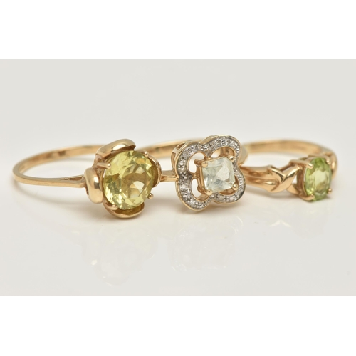 72 - THREE 9CT GOLD GEM SET RINGS, the first a circular cut citrine ring, ring size N, the second an oval... 