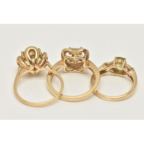 72 - THREE 9CT GOLD GEM SET RINGS, the first a circular cut citrine ring, ring size N, the second an oval... 