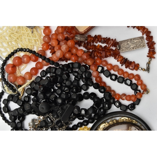 102 - A BAG OF ASSORTED COSTUME JEWELLERY, to include a carnelian bead necklace fitted with a white metal ... 