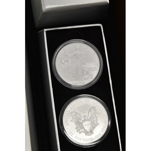 197 - A CASED DISPLAY OF USA SILVER DOLLAR COINS, to include Eagle Silver dollar coins  in individual boxe... 