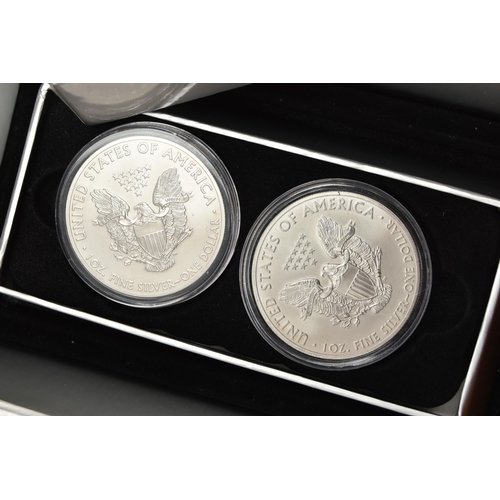 197 - A CASED DISPLAY OF USA SILVER DOLLAR COINS, to include Eagle Silver dollar coins  in individual boxe... 