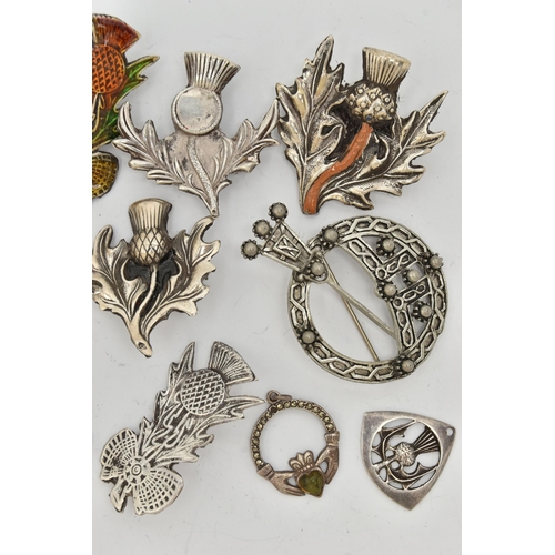 80 - A SELECTION OF MAINLY SCOTTISH RELATED JEWELLERY, to include various thistle brooches, some with ena... 