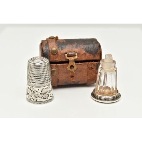 90 - A THIMBLE SCENT BOTTLE AND LEATHER CHEST CASE, the thimble with engraved foliate decoration, the bas... 