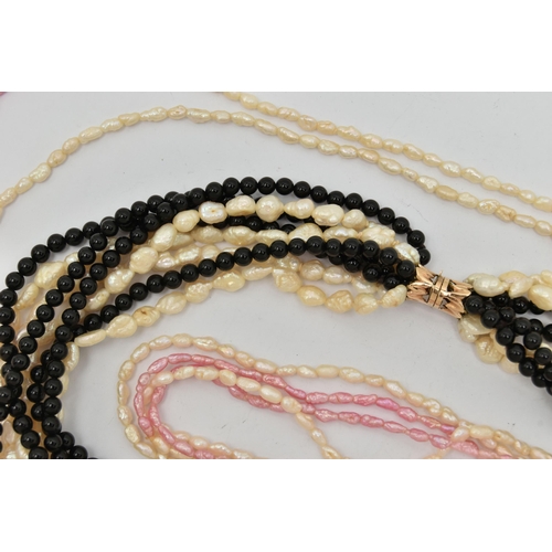 91 - FOUR CULTURED PEARL NECKLACES, the first a multi strand necklace with white baroque pearls and onyx ... 