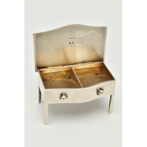 126 - AN EARLY 20TH CENTURY SILVER STAMP HOLDER, in the form of a miniature bow fronted desk, hinged cover... 