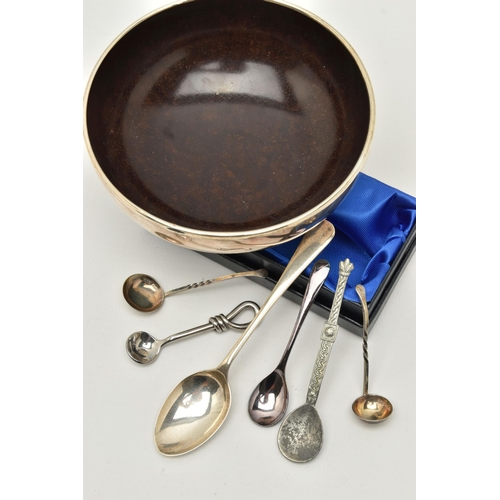 129 - A SILVER BOWL AND ASSORTED SPOONS, the polished round silver bowl with brown Bakelite interior, hall... 