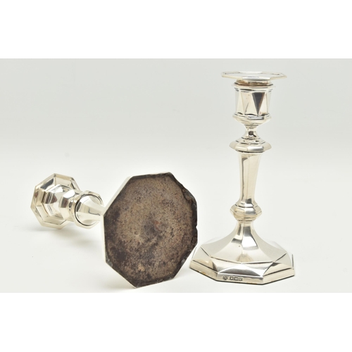 130 - A PAIR OF GEORGE V SILVER OCTAGONAL AND MULTI FACETED CANDLESTICKS RETAILED BY ASPREY, fixed sconce ... 