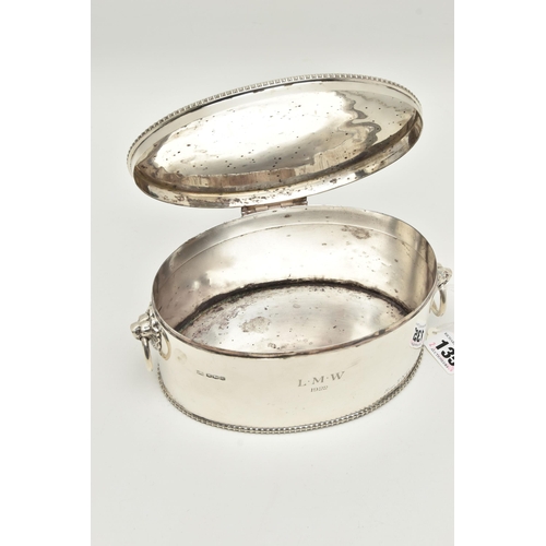 135 - A GEORGE V SILVER BISCUIT/CRACKER BARREL OF OVAL FORM WITH LION MASK RING HANDLES, cast rims, the fr... 