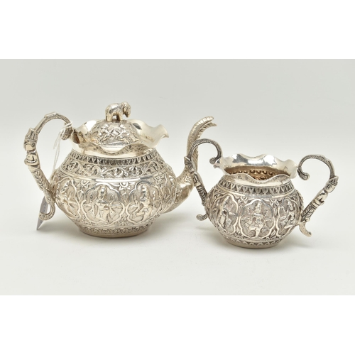 138 - AN INDIAN WHITE METAL TWO PIECE BACHELOR'S TEA SET, comprising teapot and twin handled sugar bowl, e... 