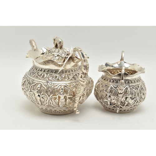 138 - AN INDIAN WHITE METAL TWO PIECE BACHELOR'S TEA SET, comprising teapot and twin handled sugar bowl, e... 