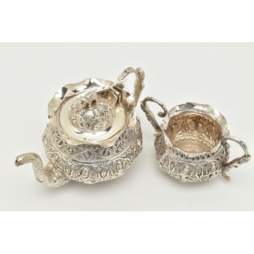 138 - AN INDIAN WHITE METAL TWO PIECE BACHELOR'S TEA SET, comprising teapot and twin handled sugar bowl, e... 