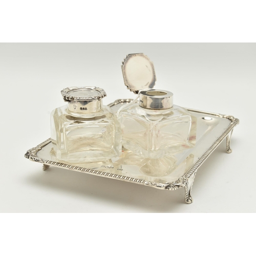 139 - A LATE VICTORIAN SILVER INKSTAND OF RECTANGULAR FORM, foliate scroll and shell cast corners, reeded ... 