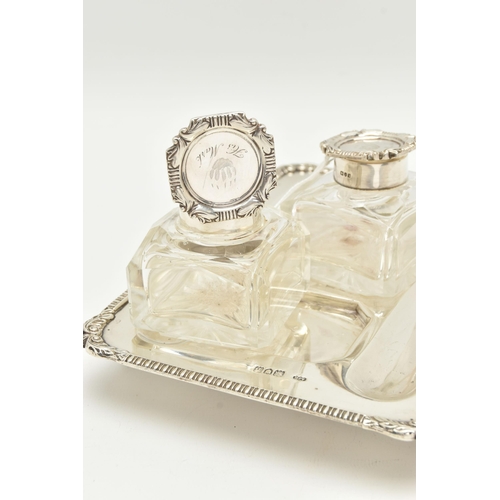 139 - A LATE VICTORIAN SILVER INKSTAND OF RECTANGULAR FORM, foliate scroll and shell cast corners, reeded ... 