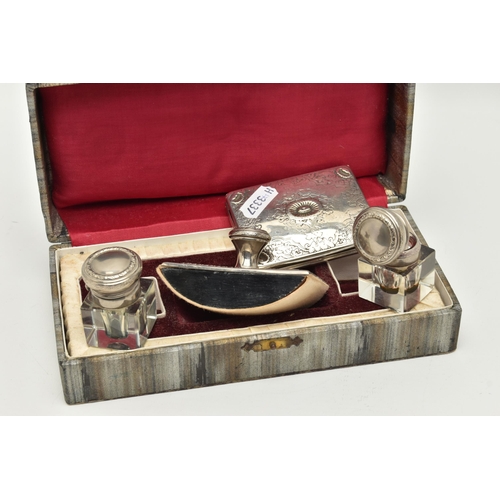 149 - A DESK SET AND A WHITE METAL BOX, desk set containing two glass ink wells with hinged white metal co... 