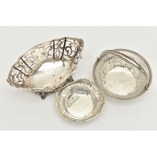 158 - THREE EARLY 20TH CENTURY PIERCED SILVER BONBON DISHES/NUT DISHES, comprising a George V circular swi... 