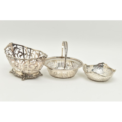 158 - THREE EARLY 20TH CENTURY PIERCED SILVER BONBON DISHES/NUT DISHES, comprising a George V circular swi... 