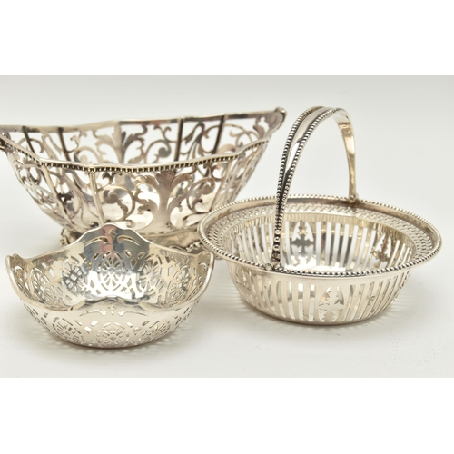 158 - THREE EARLY 20TH CENTURY PIERCED SILVER BONBON DISHES/NUT DISHES, comprising a George V circular swi... 