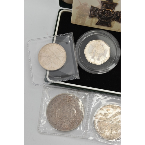 216 - A PARCEL CONTAINING SILVER UK COINAGE, to include The Victoria Cross 2 coin set of 50p silver proof ... 