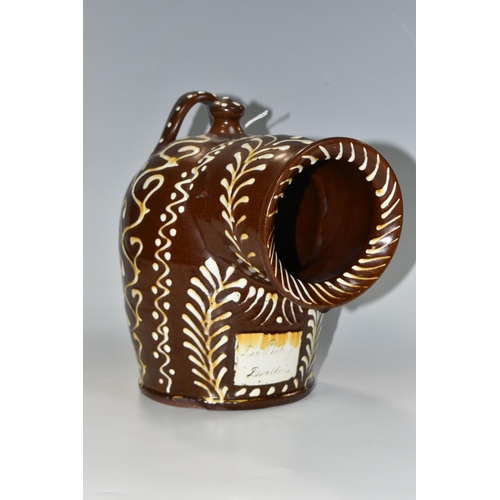 336 - A BROWN AND WHITE EARLY TWENTIETH CENTURY SLIPWARE SALT PIG, with trailed decoration, inscribed 'Dr.... 