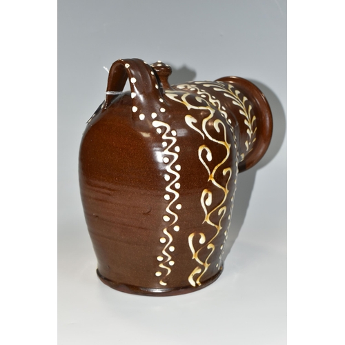 336 - A BROWN AND WHITE EARLY TWENTIETH CENTURY SLIPWARE SALT PIG, with trailed decoration, inscribed 'Dr.... 