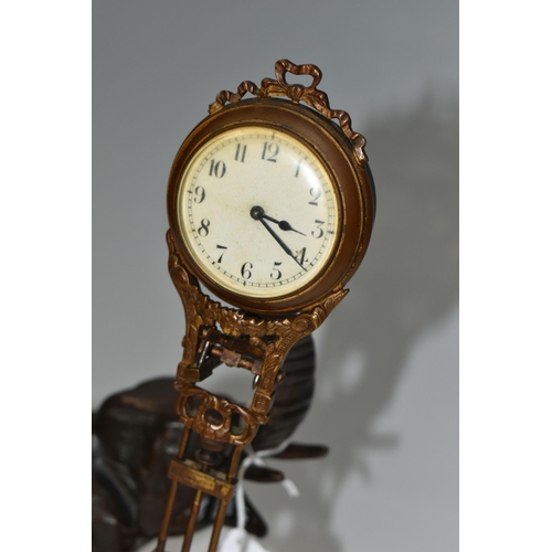 342 - A SPELTER SWINGING ELEPHANT CLOCK, a twentieth century spelter elephant clock, the dial and movement... 