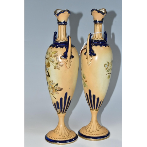 345 - A PAIR OF LATE NINETEENTH CENTURY AUSTRIAN PEDESTAL VASES, hand painted blossom design on a blush iv... 