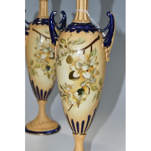 345 - A PAIR OF LATE NINETEENTH CENTURY AUSTRIAN PEDESTAL VASES, hand painted blossom design on a blush iv... 