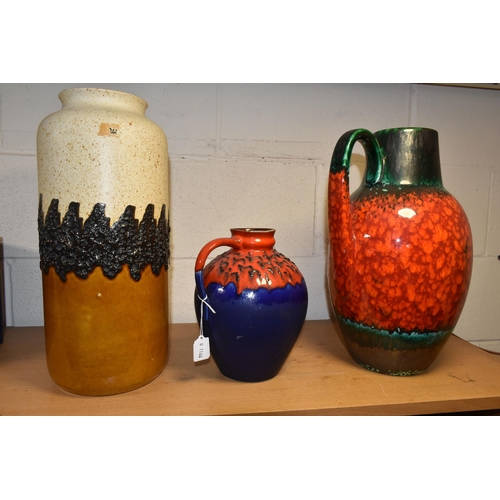 350 - A MID TWENTIETH CENTURY FLOOR VASE AND TWO LARGE JUGS,  comprising a large red, green and black jug,... 