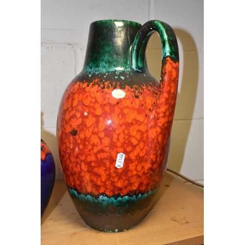 350 - A MID TWENTIETH CENTURY FLOOR VASE AND TWO LARGE JUGS,  comprising a large red, green and black jug,... 