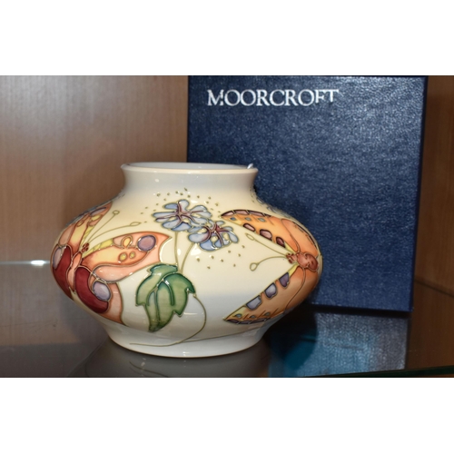 351 - A BOXED MOORCROFT POTTERY 'BUTTERFLY' PATTERN VASE, designed by Sally Tuffin, the squat baluster vas... 