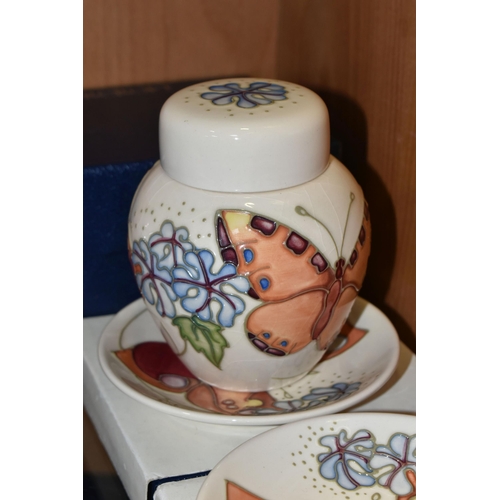 361 - A BOXED MOORCROFT POTTERY 'BUTTERFLY' PATTERN GINGER JAR AND TWO BOXED TRINKET DISHES, designed by S... 