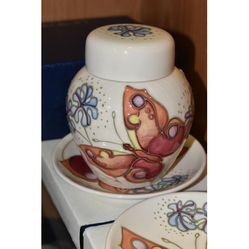 361 - A BOXED MOORCROFT POTTERY 'BUTTERFLY' PATTERN GINGER JAR AND TWO BOXED TRINKET DISHES, designed by S... 