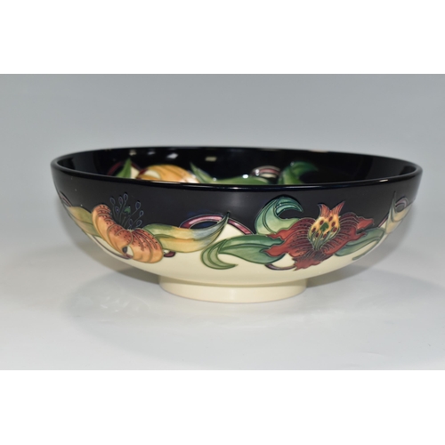 364 - A BOXED MOORCROFT POTTERY 'ANNA LILY' DESIGN BOWL, designed by Nicola Slaney, diameter 26cm (1) (Con... 